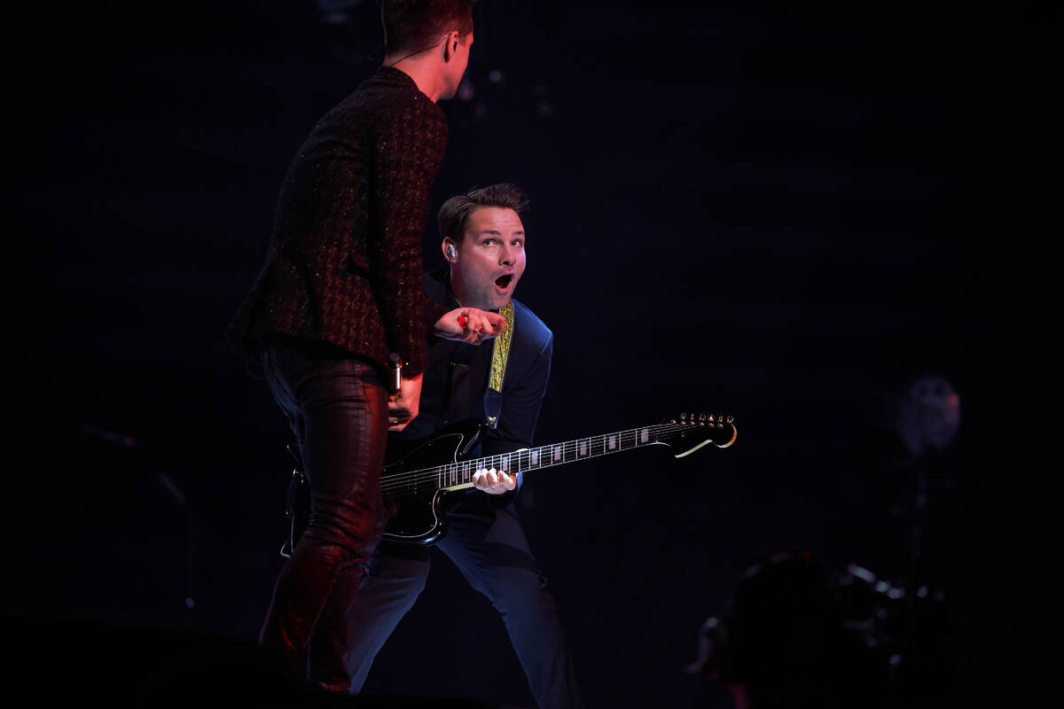 Brendon Urie and the horn section of Panic! At The Disco is shown in concert at T-Mobile Arena ...