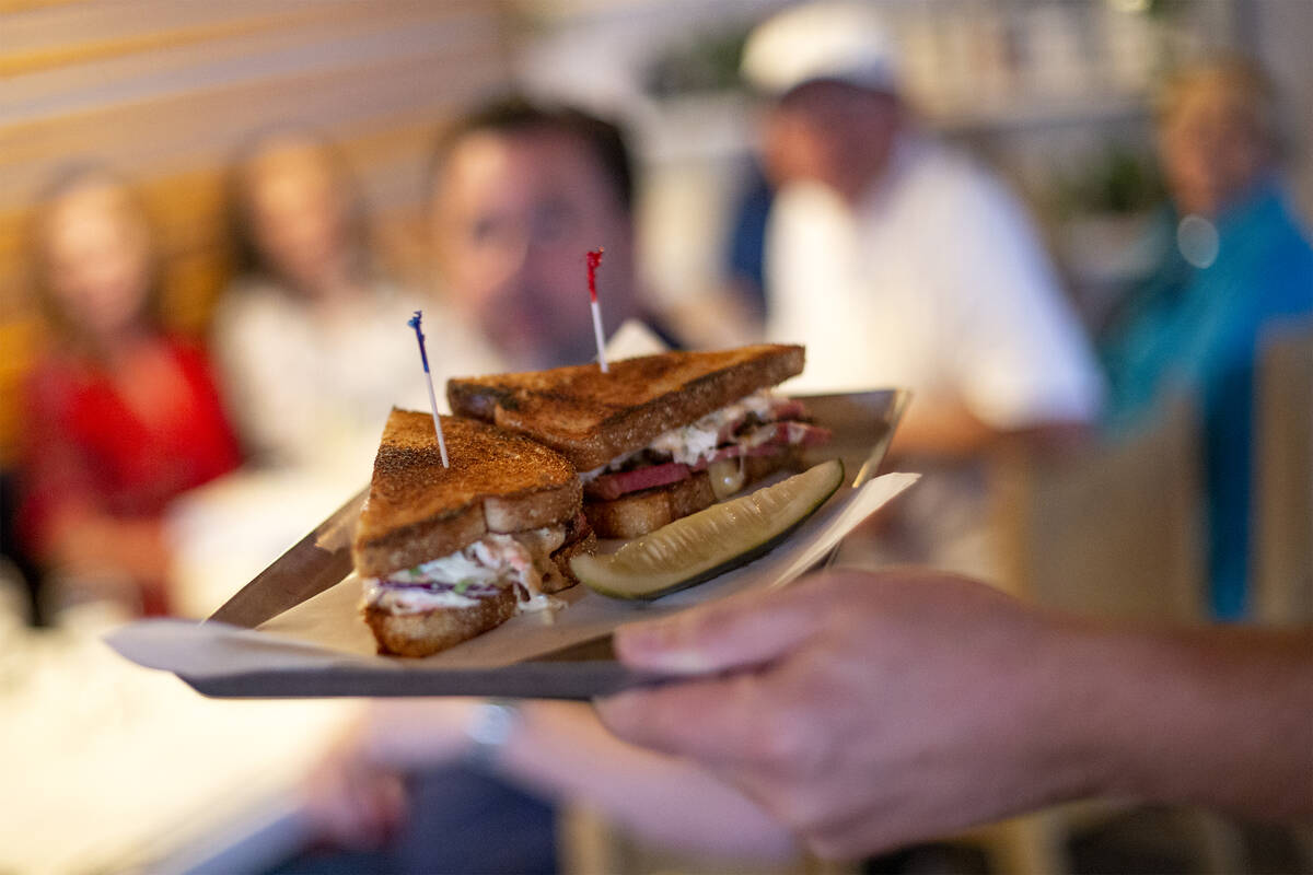 Jerad Howard prepares the pastrami reuben during restaurant concept Dinette’s judging ev ...