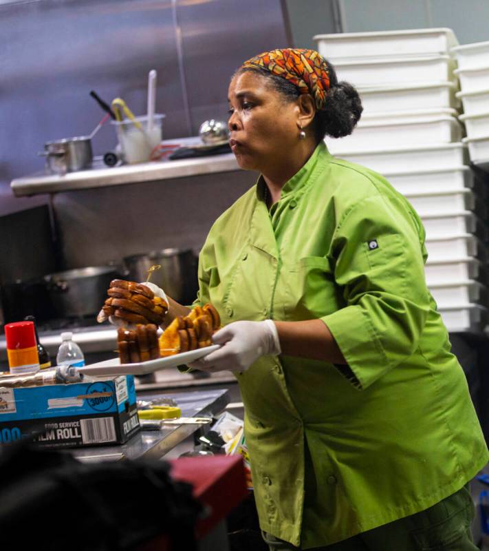 Chef Dia Young plates Jersey Boys PBJ&B sandwiches during a presentation by Random Act Din ...