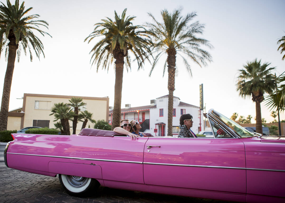 Ron Decar, owner of Viva Las Vegas and dressed as Elvis, drives Missie Berry and Robert Moseley ...