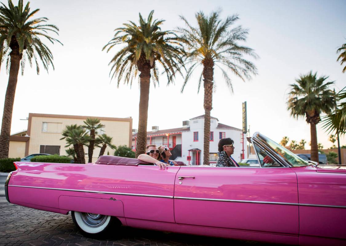 Ron Decar, owner of Viva Las Vegas and dressed as Elvis, drives Missie Berry and Robert Moseley ...