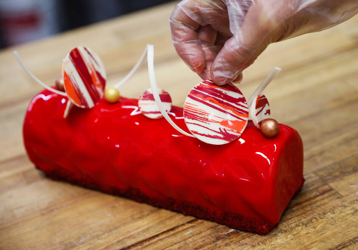 Executive Pastry Chef Doug Taylor adds finishing touches to a Father’s Day special panna ...