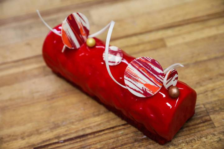 Executive Pastry Chef Doug Taylor adds finishing touches to a Father’s Day special panna ...