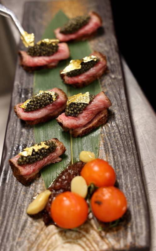 Bites fashioned from A5 grade wagyu beef, osetra caviar, truffle sauce and gold leaf by executi ...