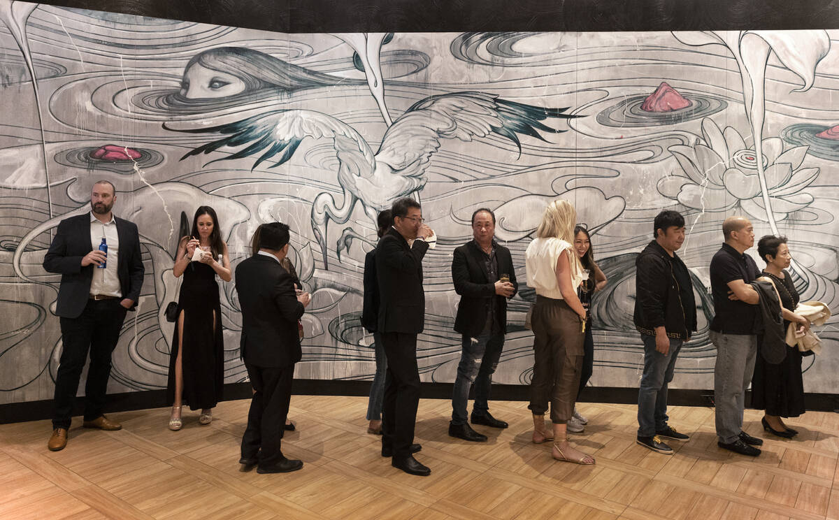 Guests wait in line at Send Noodles during the pre-opening party at the Palms on Wednesday, Apr ...