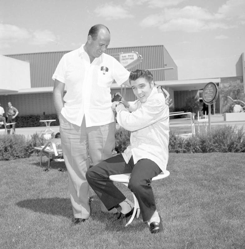 Colonel Tom Parker and Elvis Presley are photographed in April 1956 during the singer's first L ...
