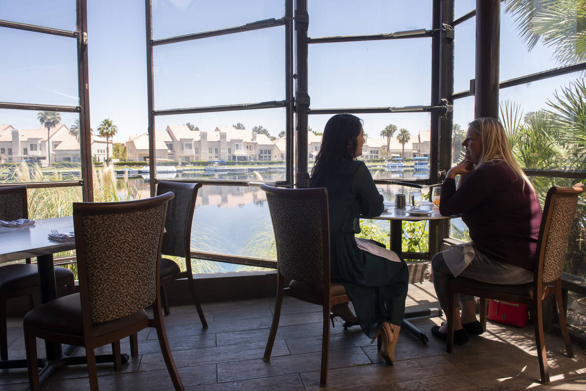 April Platon, left, and Valerie Maldonado eat lunch on the lakeside patio at Marché Bacchu ...