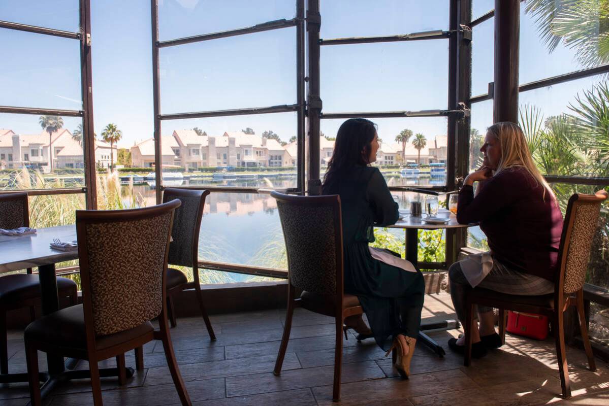 April Platon, left, and Valerie Maldonado eat lunch on the lakeside patio at Marché Bacchu ...
