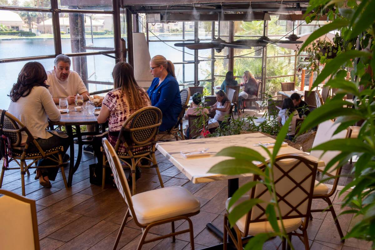 Diners eat lunch on the lakeside patio at Marché Bacchus on Wednesday, June 15, 2022, in L ...