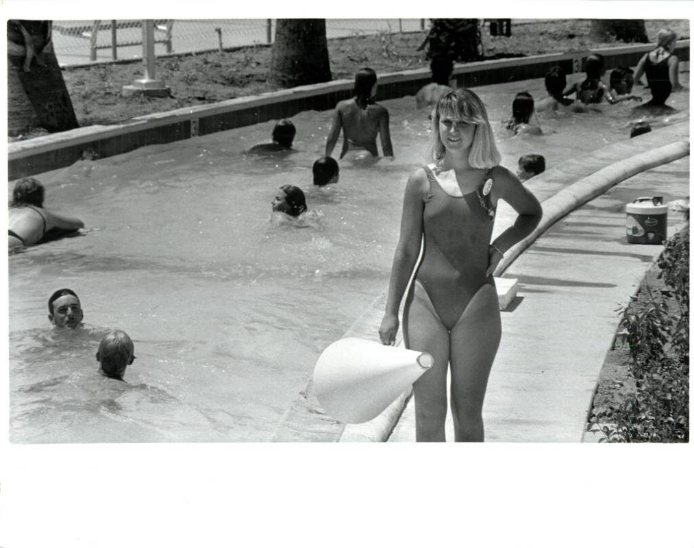 Lifeguard Natalie Murphy watches guests swim in the lazy river at Wet 'n' Wild on Las Vegas Bou ...