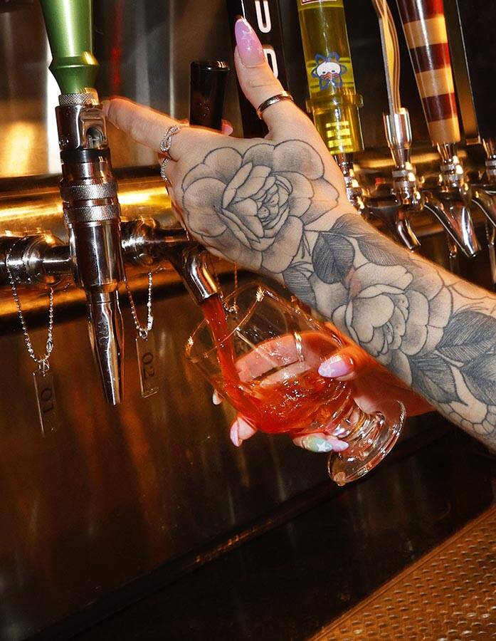 Devin Costentine, Atomic Liquors lead bartender pours Joseph James Suave Felon #003 into a glas ...