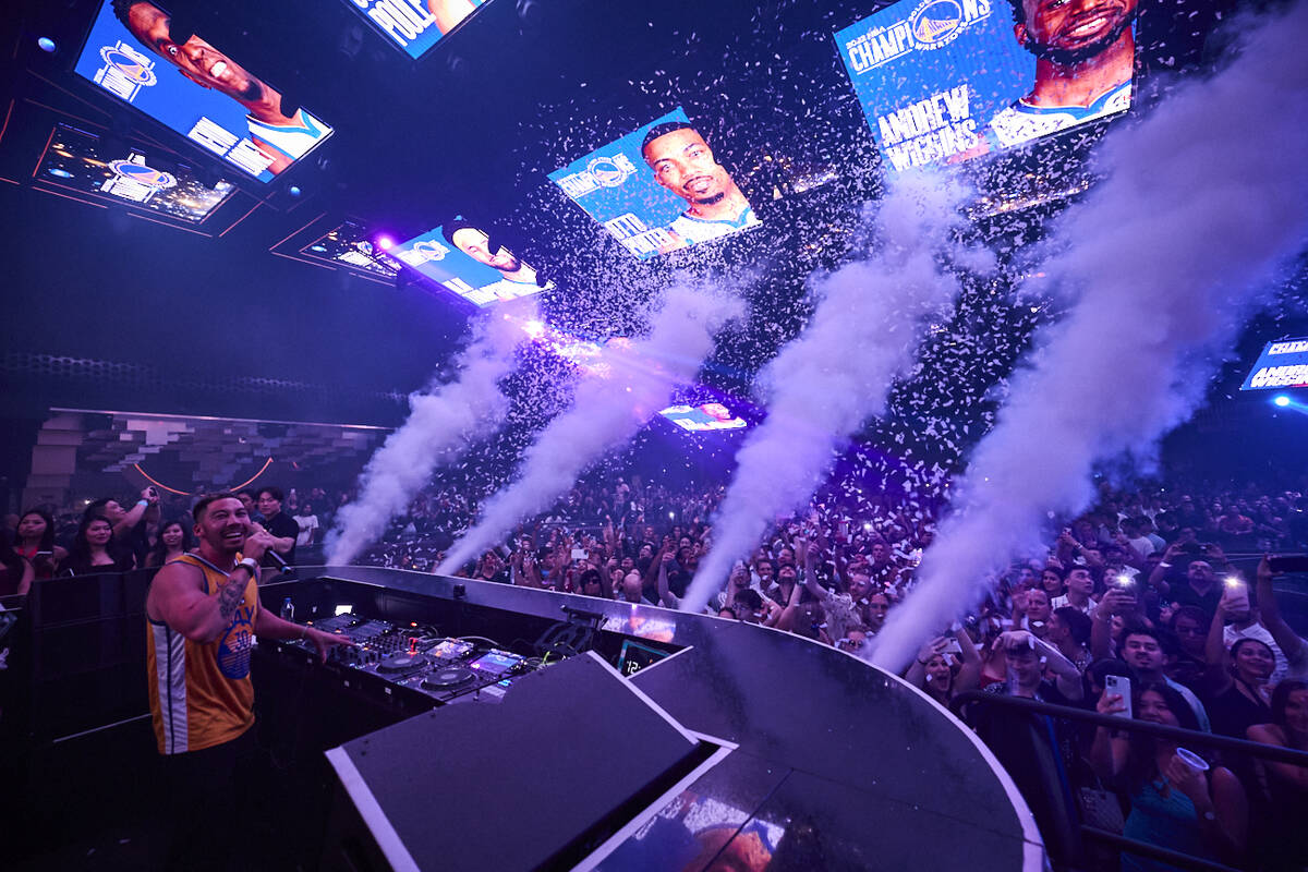 DJ Flight fires the party cannons as the Golden State Warriors celebrate their NBA championship ...