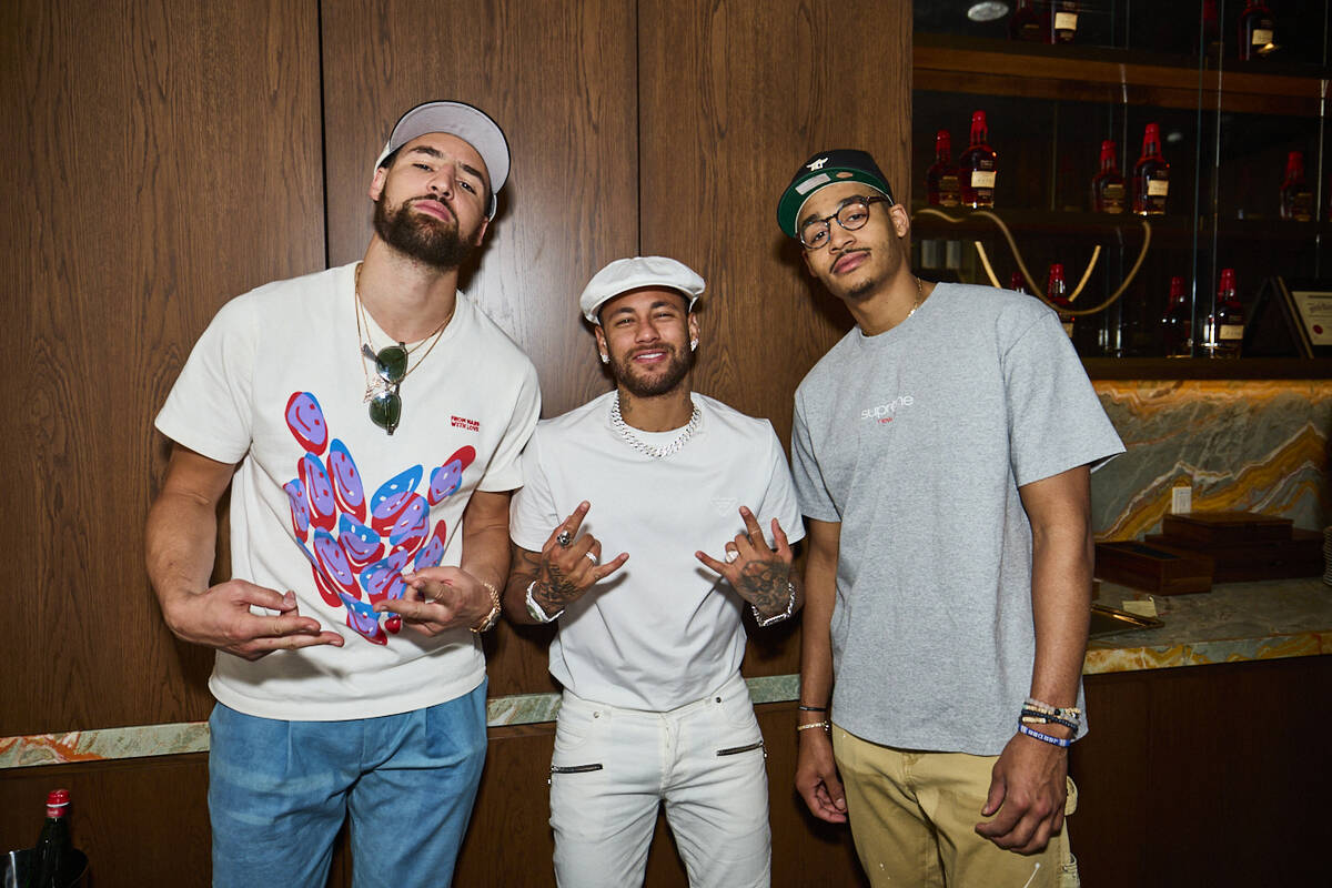 Klay Thompson, far left, and Jordan Poole of the Golden State Warriors are shown with soccer st ...