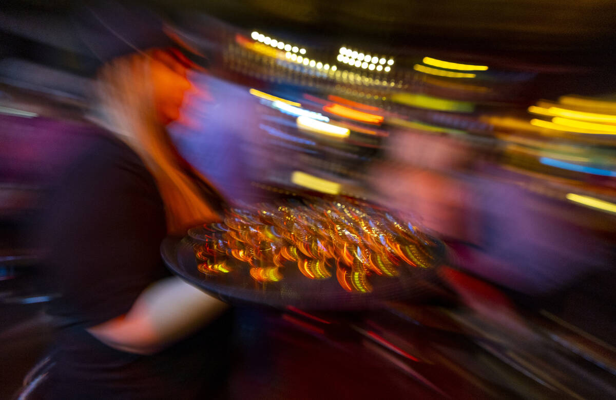 A tray of Jameson shots are delivered to patrons who will toast the official start of the Atomi ...