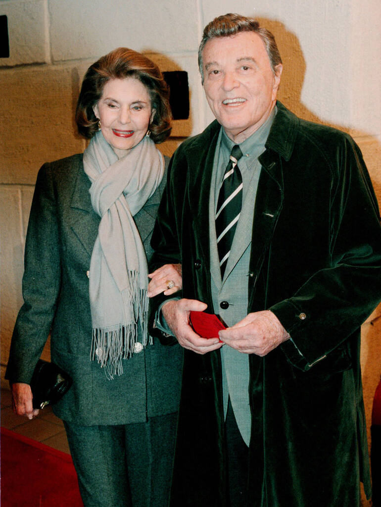 Cyd Charisse and her husband, singer Tony Martin, pose for photographers as they arrive for the ...