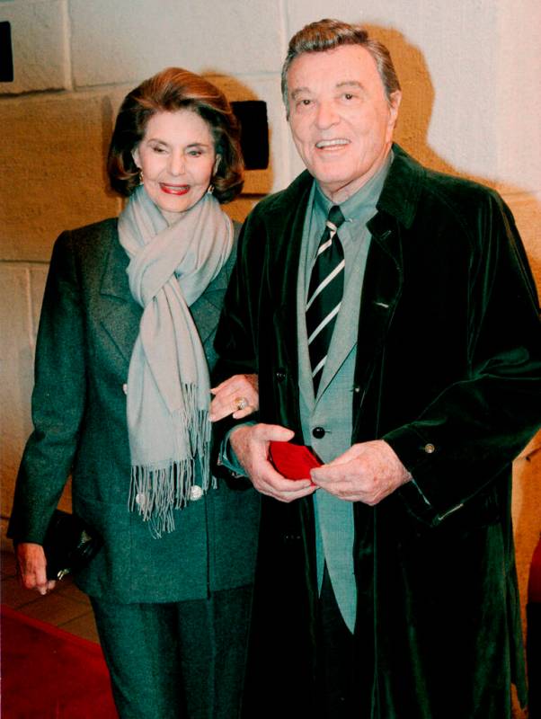 Cyd Charisse and her husband, singer Tony Martin, pose for photographers as they arrive for the ...