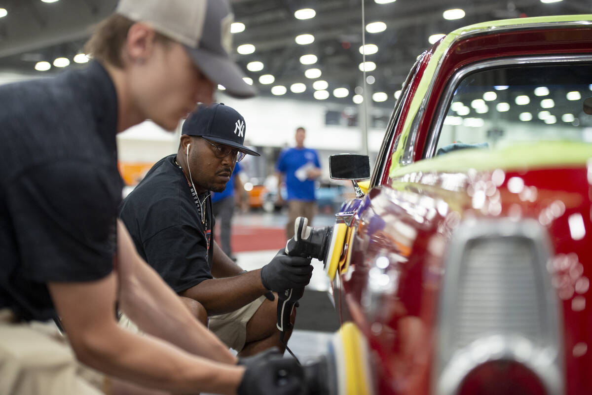 David Cheek of New Jersey polishes a 1966 Ford Ranchero Pickup during the set-up for the Barret ...