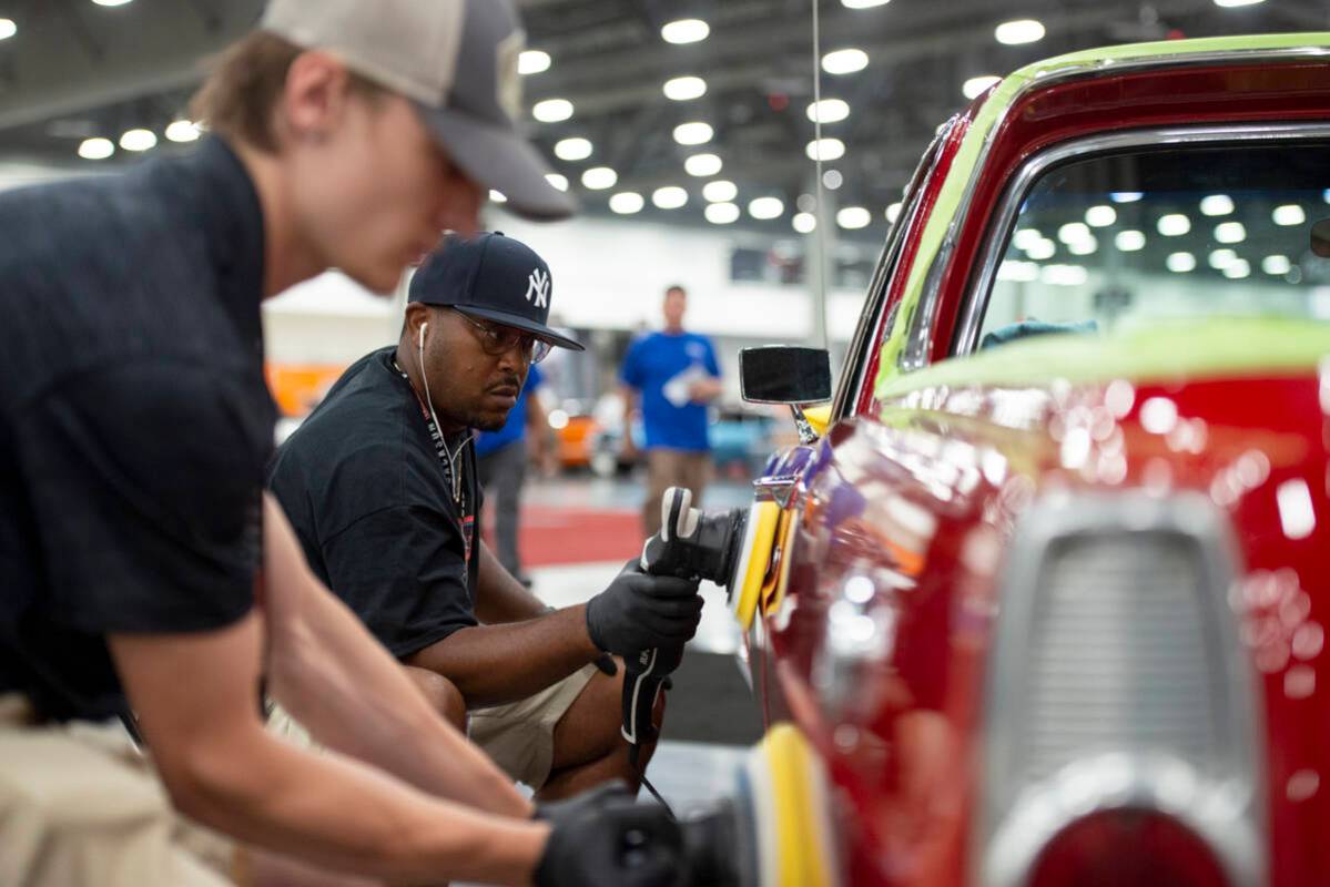 David Cheek of New Jersey polishes a 1966 Ford Ranchero Pickup during the set-up for the Barret ...