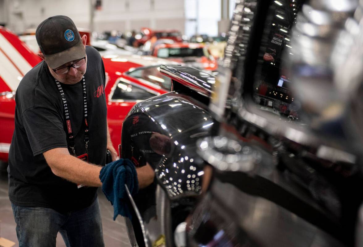 Don Williams, of Alberta, Canada, details a 1977 Chevrolet custom pickup before the the Barrett ...