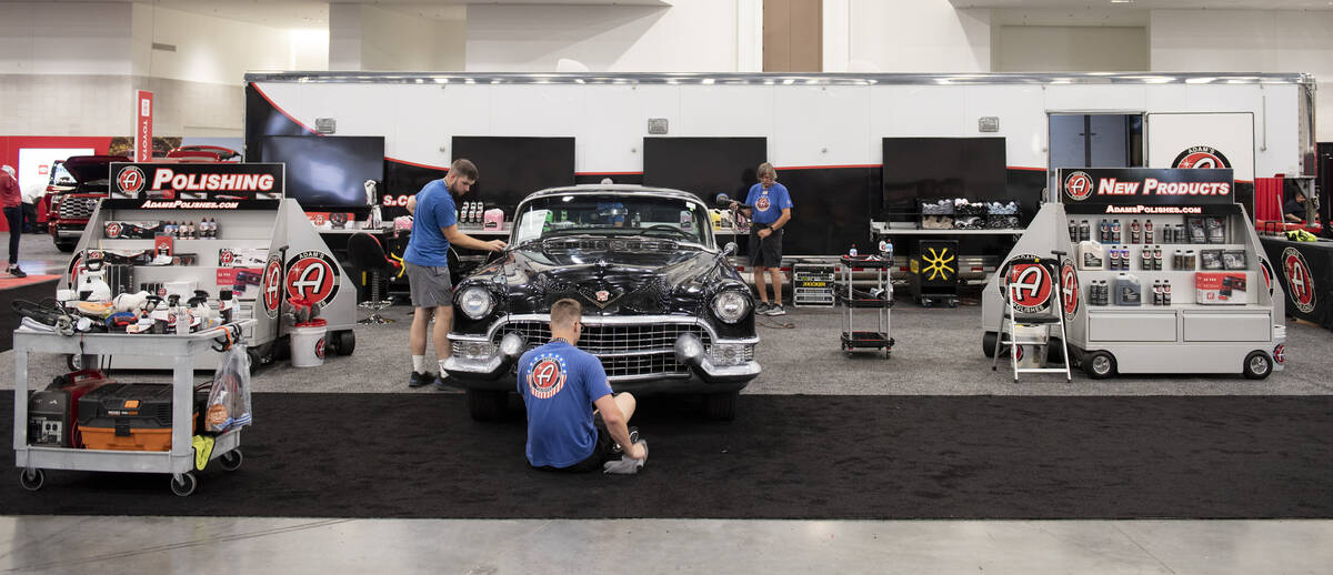 Workers for Adams Polishes detail a 1955 Cadillac Coupe during the set-up for the Barrett-Jacks ...
