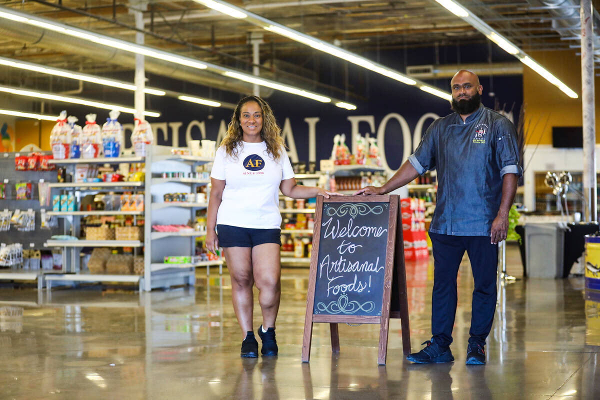 Co-owners of Artisanal Foods Jinelle Batista, left, stands with her husband, Chef Jon Batista, ...