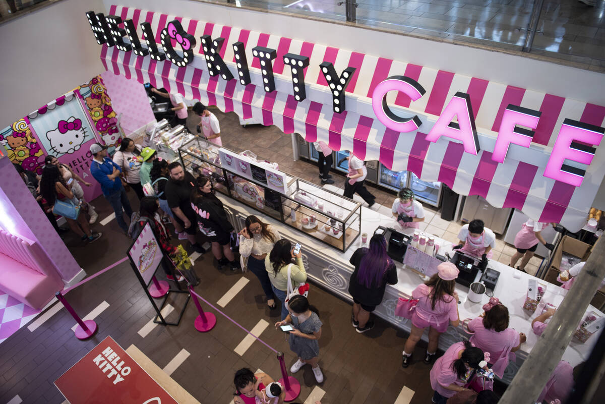 Customers wait in line at the new Hello Kitty Cafe during the grand opening inside Fashion Show ...
