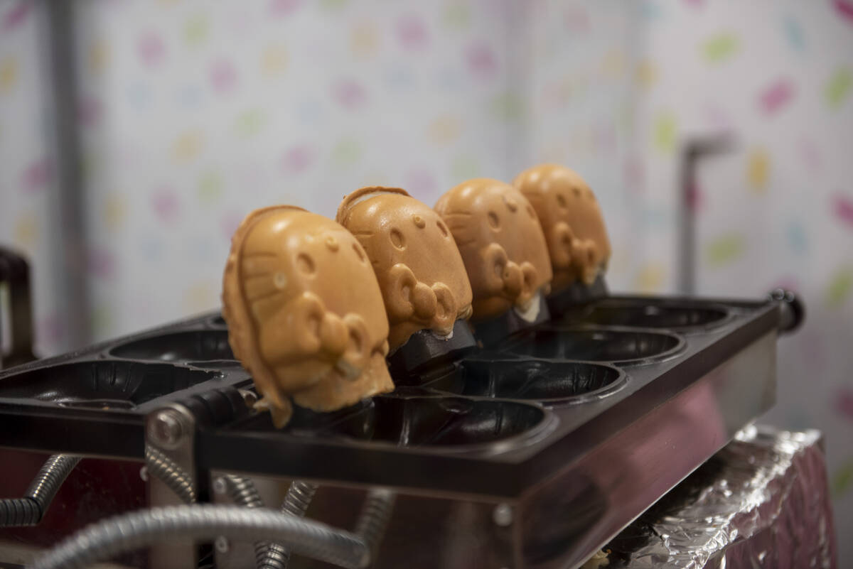 The waffle-batter shells for the cafe's signature treat, soft served ice cream inside a cone mo ...