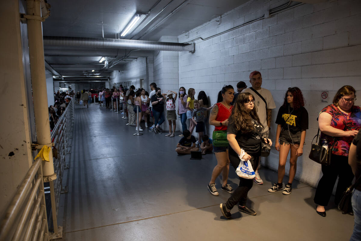 Customers line up in the parking lot for the grand opening of the new Hello Kitty Cafe inside F ...