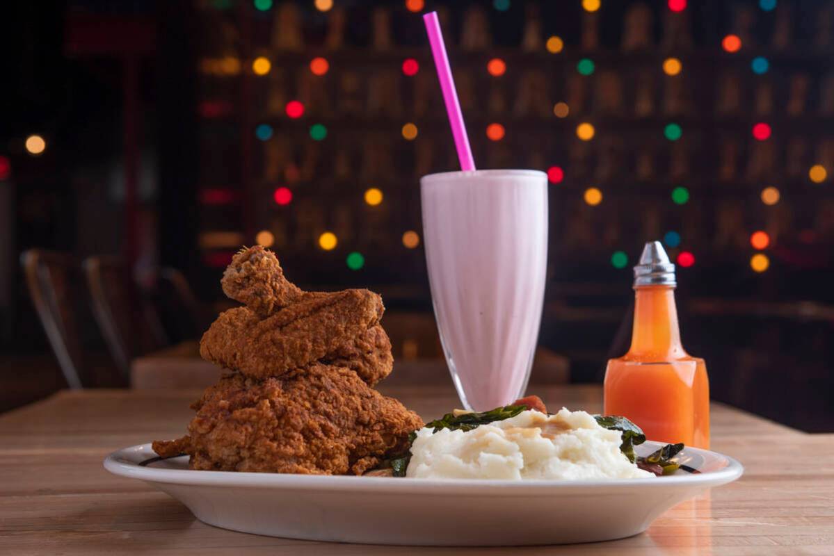 The fried chicken dinner with hot sauce and a strawberry milkshake at Brooklyn Bowl on Friday, ...