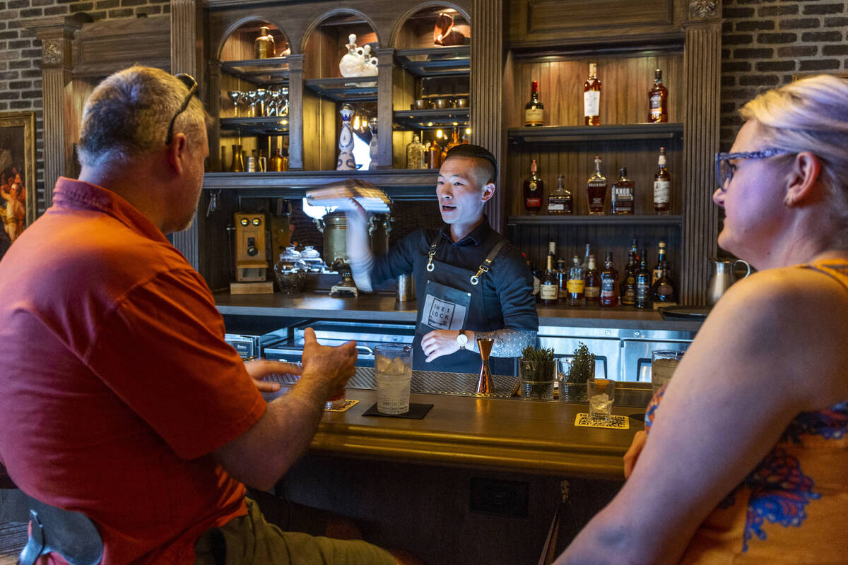 Jesse and Michelle Ferguson of Rochester, New York, enjoy a drink from bartender Riki Taiga abo ...