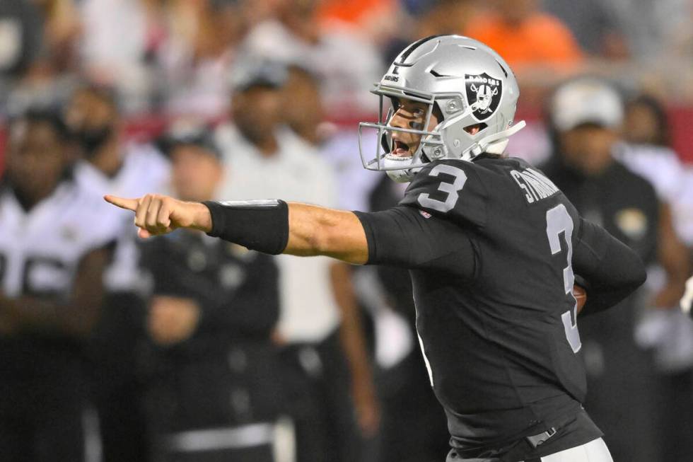 Las Vegas Raiders quarterback Jarrett Stidham (3) runs for a touchdown during the NFL football ...