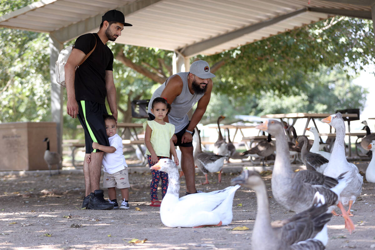 Las Vegas residents Meilad Naem, from left, with his children Messiah, 1, Mena, 2, and his brot ...