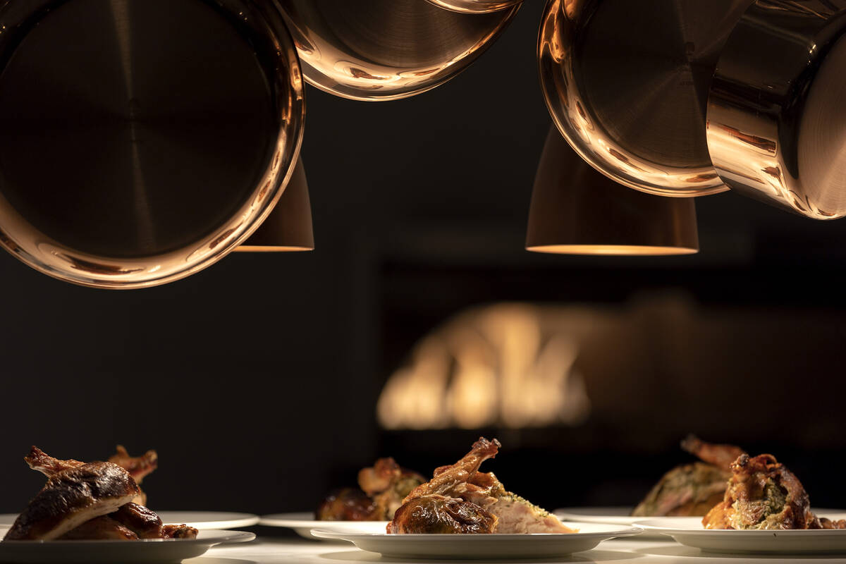 The roast chicken stuffed with herbed breadcrumbs is ready on the pass during a media roundtabl ...
