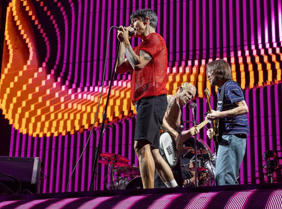 (From left) Lead singer Anthony Kiedis, Bassist Flea and lead guitar John Frusciante perform as ...