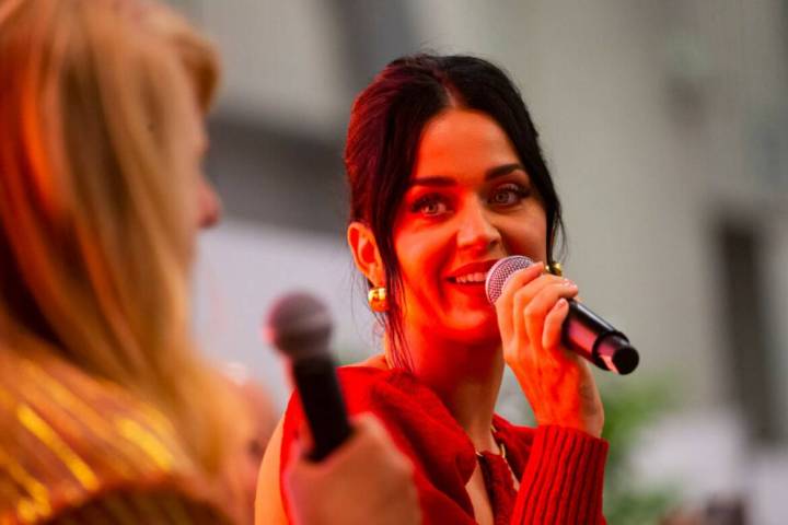 Katy Perry, right, talks with moderator Booth Moore during the MAGIC Las Vegas fashion trade sh ...