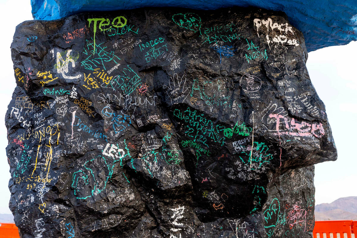 A base stone is covered in graffiti at Seven Magic Mountains as the art installation undergoes ...