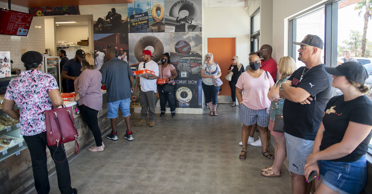 The lines wraps around the store at Randy's Donuts on South Rainbow Boulevard on Friday, Aug. 1 ...