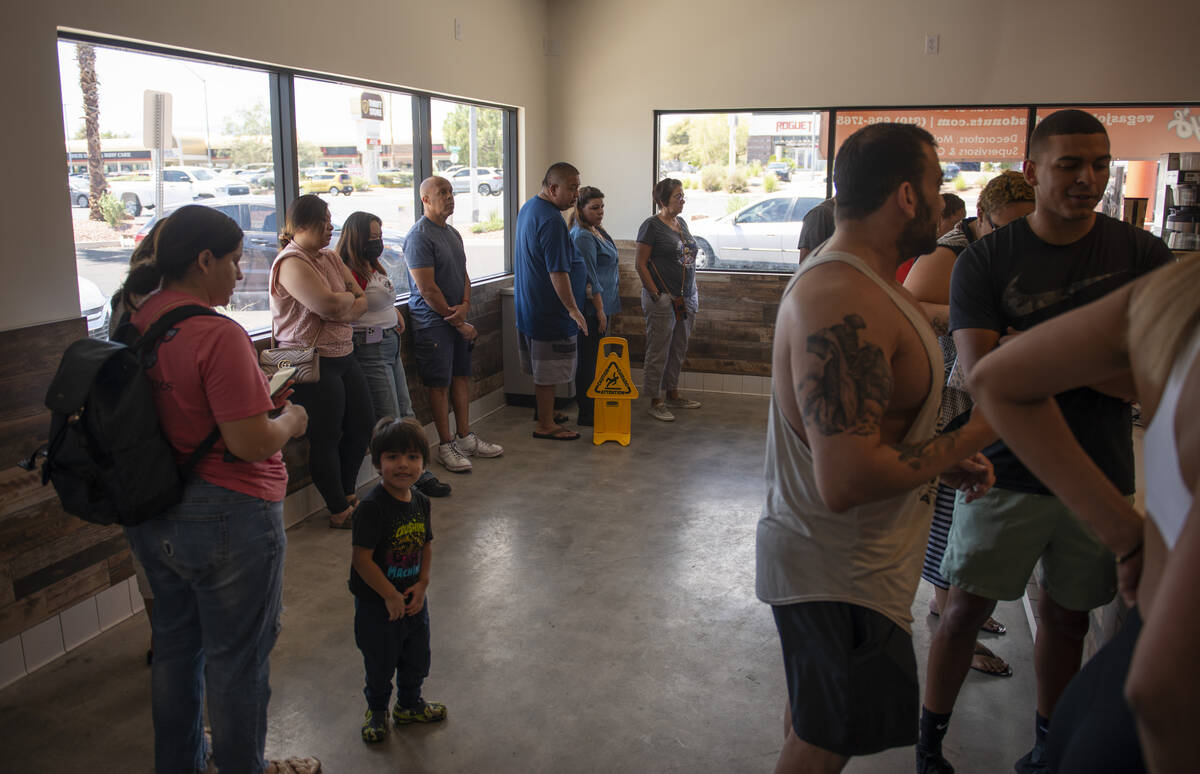 The lines wraps around the store at Randy's Donuts on South Rainbow Boulevard on Friday, Aug. 1 ...