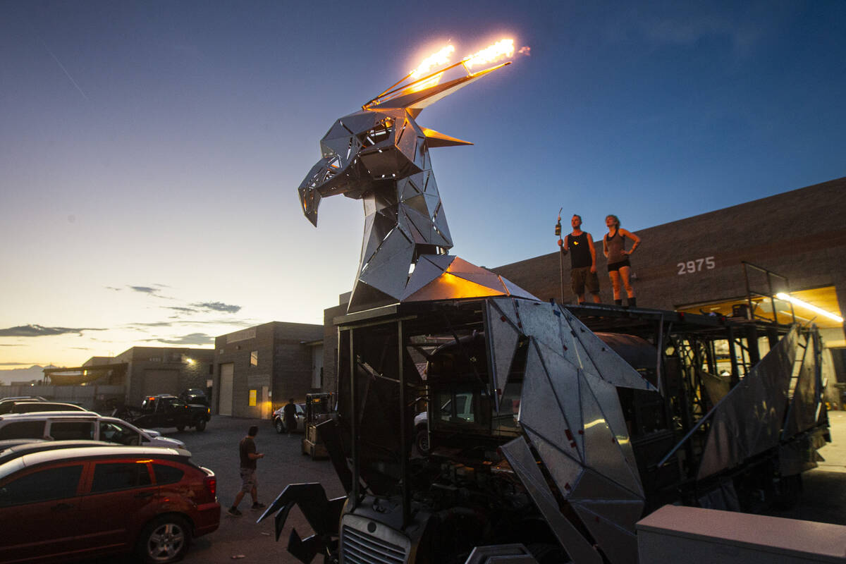 Christiane Yerex, flame effects technician, right, and project lead Kevin Bracken look on at a ...