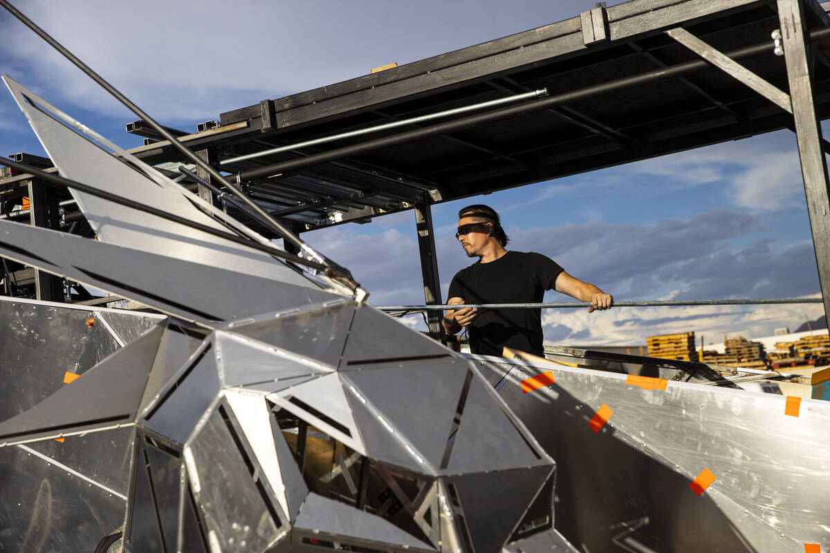 Bill Bayer, of Oakland, Calif., works on The Metaphoenix art car, in preparation for Burning Ma ...