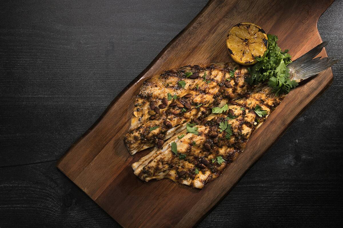 The branzino at Toca Madera steakhouse on the Las Vegas Strip, with cilantro and chipotle lime ...