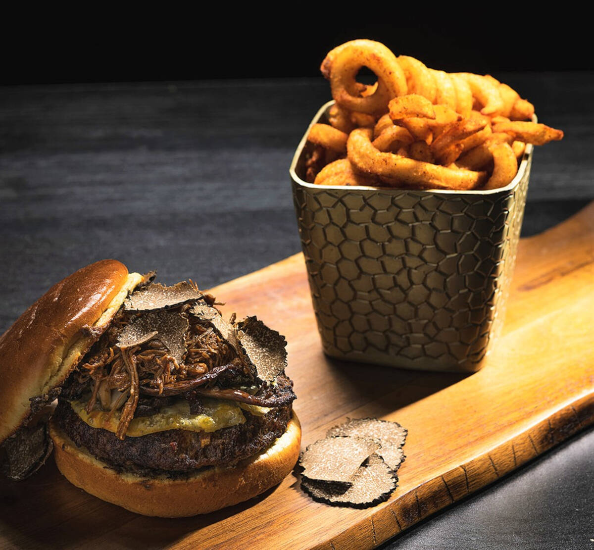 The truffle burger at Toca Madera steakhouse on the Las Vegas Strip features wagyu beef, short ...