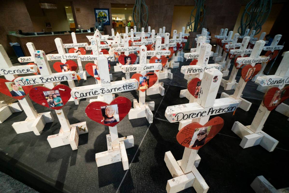 Crosses that were previously put up at the "Welcome to Fabulous Las Vegas" sign photographed on ...