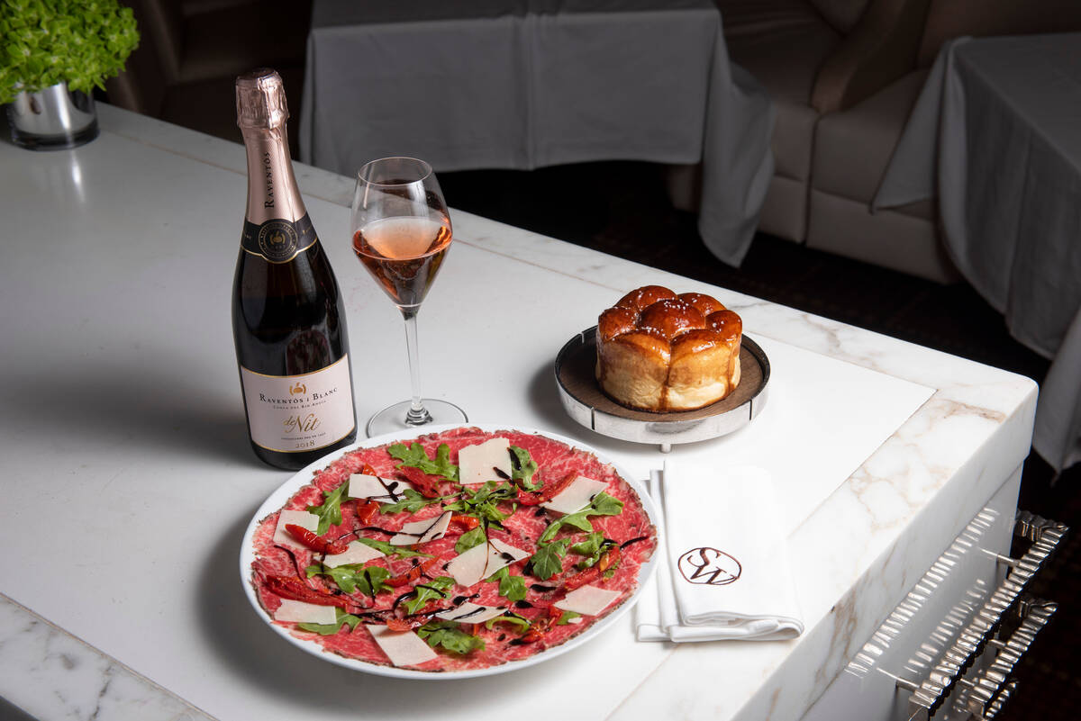 The carpaccio and monkey bread, alongside a Raventós i Blanc, at the SW Steakhouse at The ...