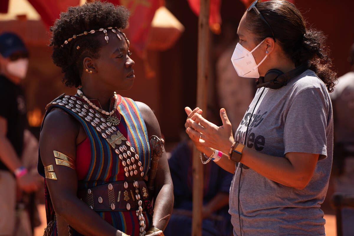 Viola Davis and director Gina Prince-Bythewood on the set of "The Woman King." (Ilze Kitshoff/T ...