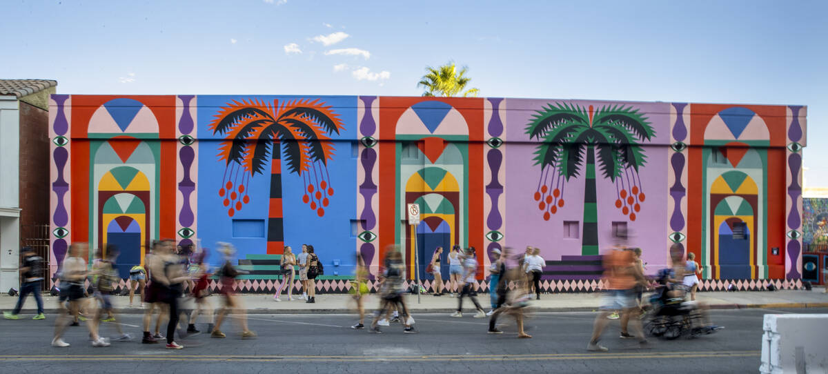 People walk along South 6th Street during day two of Life is Beautiful on Saturday, Sept. 18, 2 ...