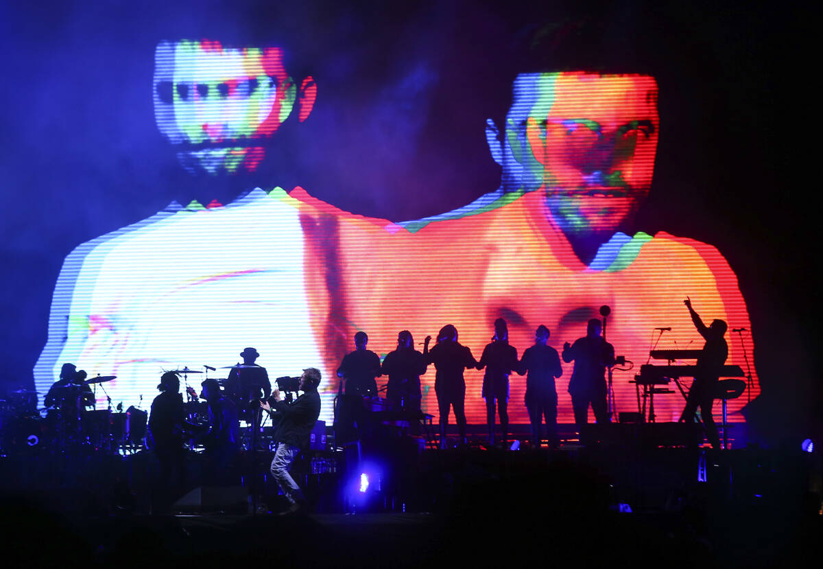 Damon Albarn of Gorillaz, lower left, performs at the Downtown stage during the final day of th ...