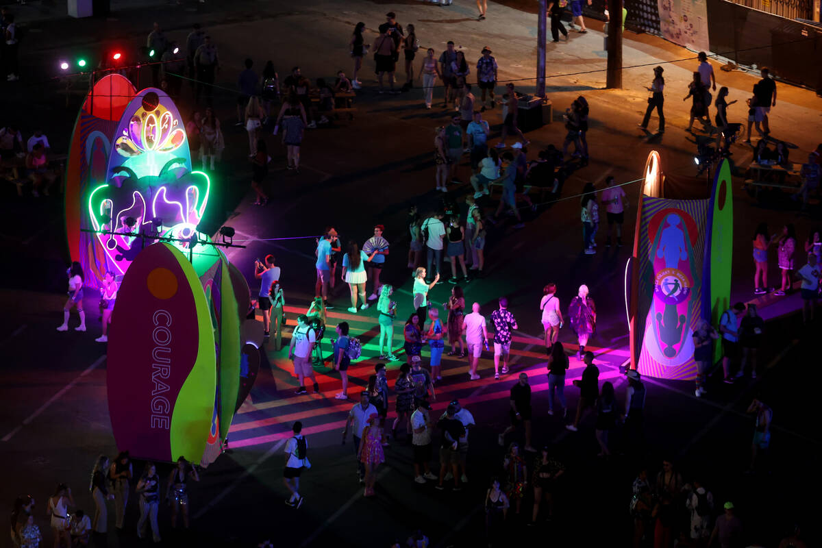 Fans gather check out the art on the first night of the Life is Beautiful music, art and food f ...