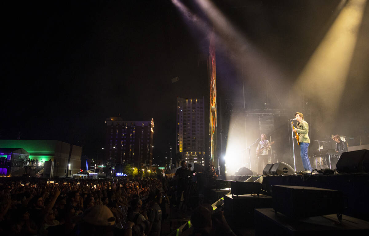 Alex Turner of the Arctic Monkeys, right, performs during the first day of the Life is Beautifu ...