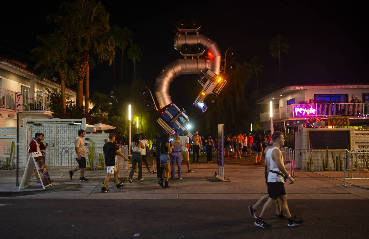 Attendees walk along Fremont Street during the first day of the Life is Beautiful festival on F ...
